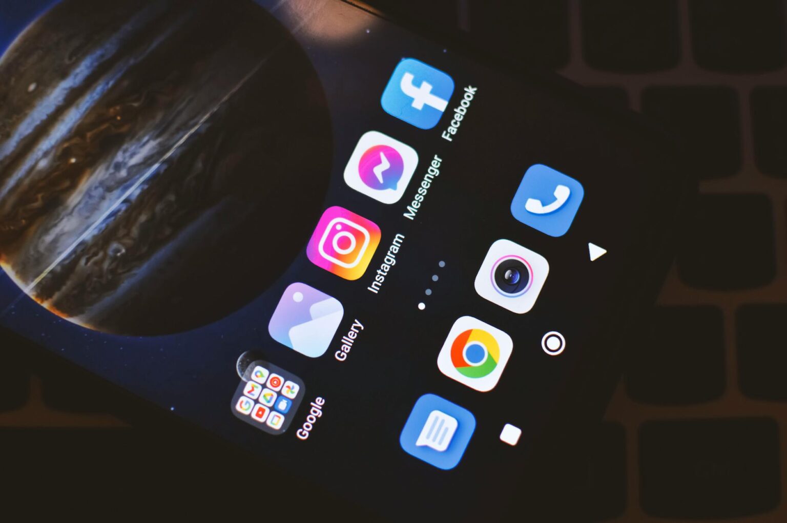 Close-up view of smartphone screen showing various mobile app icons