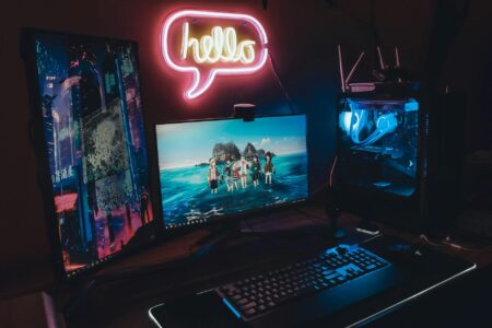 How YouTube’s Creator Revenue Sharing Changes Affect Gaming Channels Modern gaming setup with multiple monitors and streaming equipment for content creation