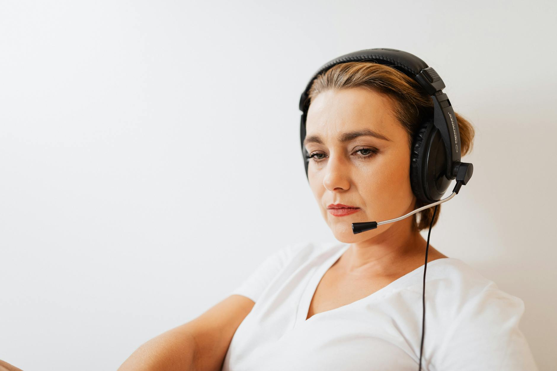 Customer service representative wearing headset in modern call center environment