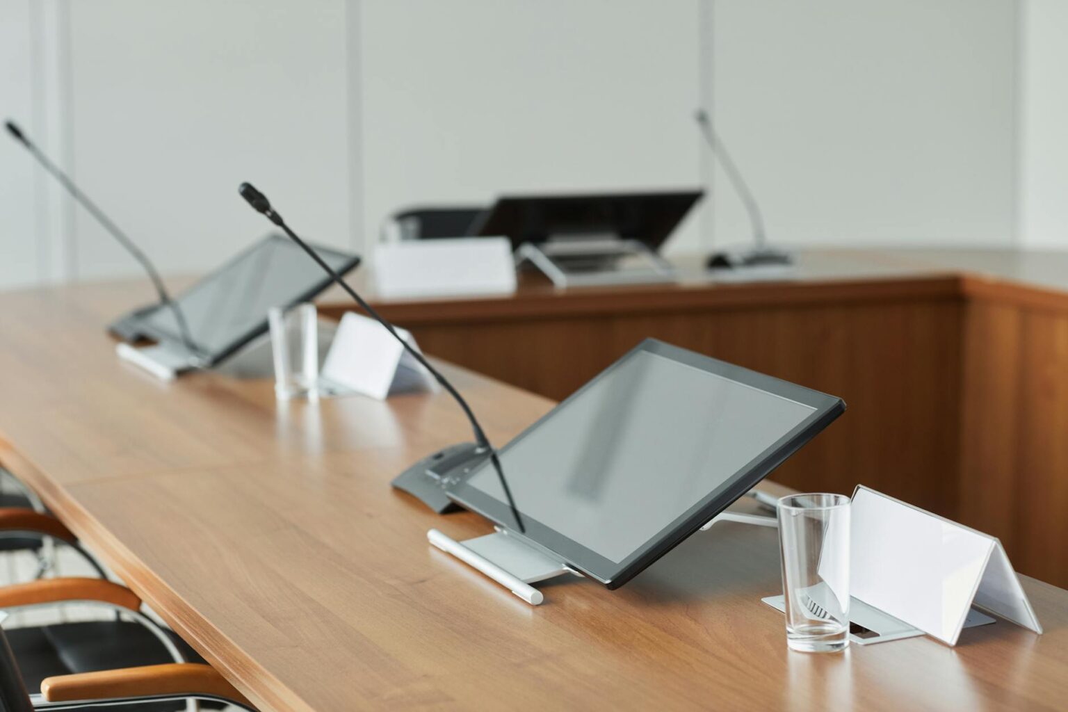 Modern conference room with large screens and video conferencing setup