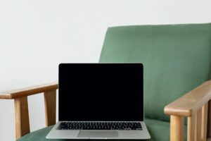 Comparing Figma vs Sketch for UI Design Teams in 2026 Designer working on laptop screen showing user interface design software