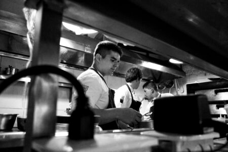 Why Former Slack Executives Are Building Team Communication Tools for Restaurants Professional restaurant kitchen with chefs working during busy service period