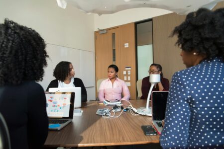 How Mastodon’s Corporate Account Verification Is Attracting Fortune 500 Companies Business professionals in a modern office meeting room discussing technology solutions