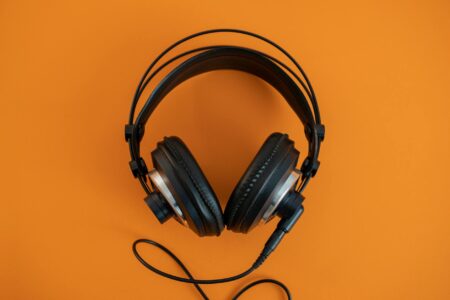 Professional headphones in a music studio setting representing AI-powered audio technology