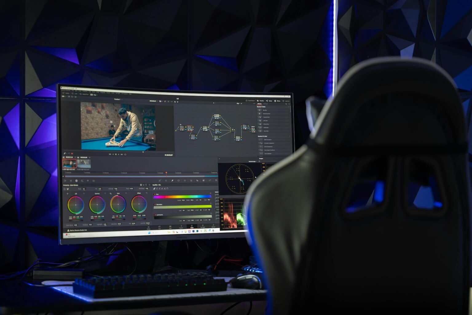 Professional video editing workspace with multiple monitors showing timeline and preview windows