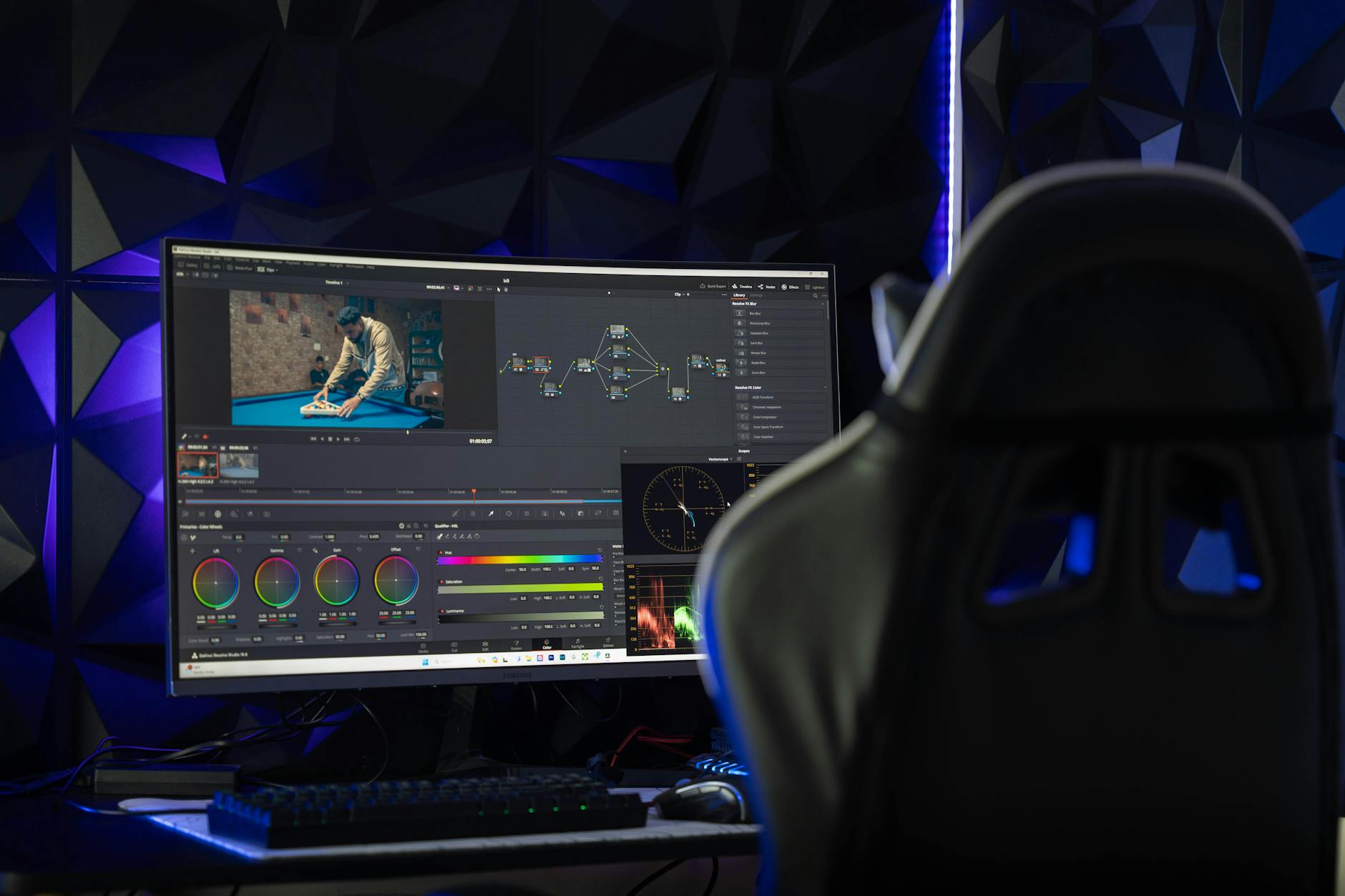 Professional video editing workspace with multiple monitors showing timeline and preview windows