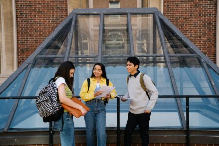 College students walking across university campus courtyard