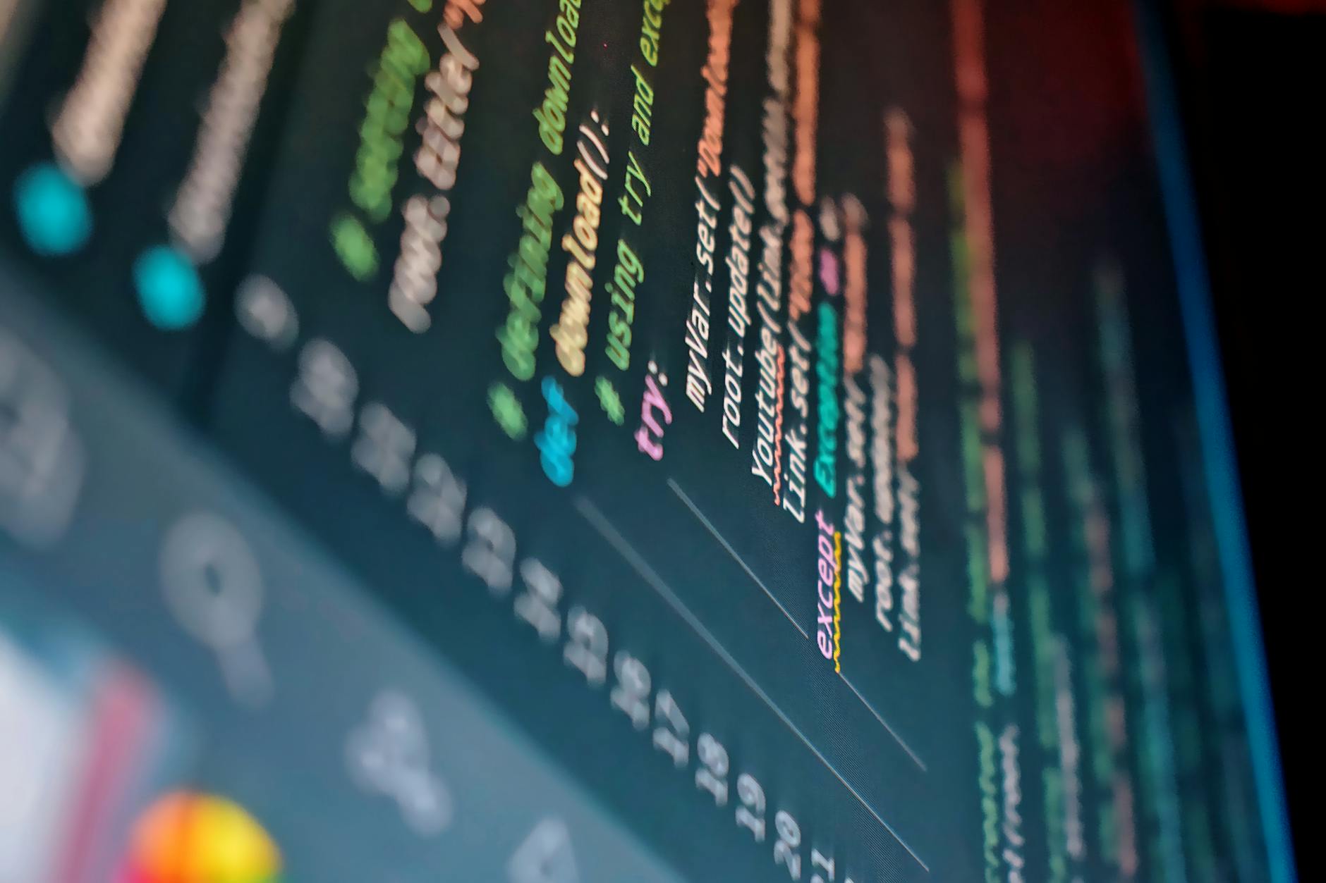 Developer reviewing code on computer screen with programming interface