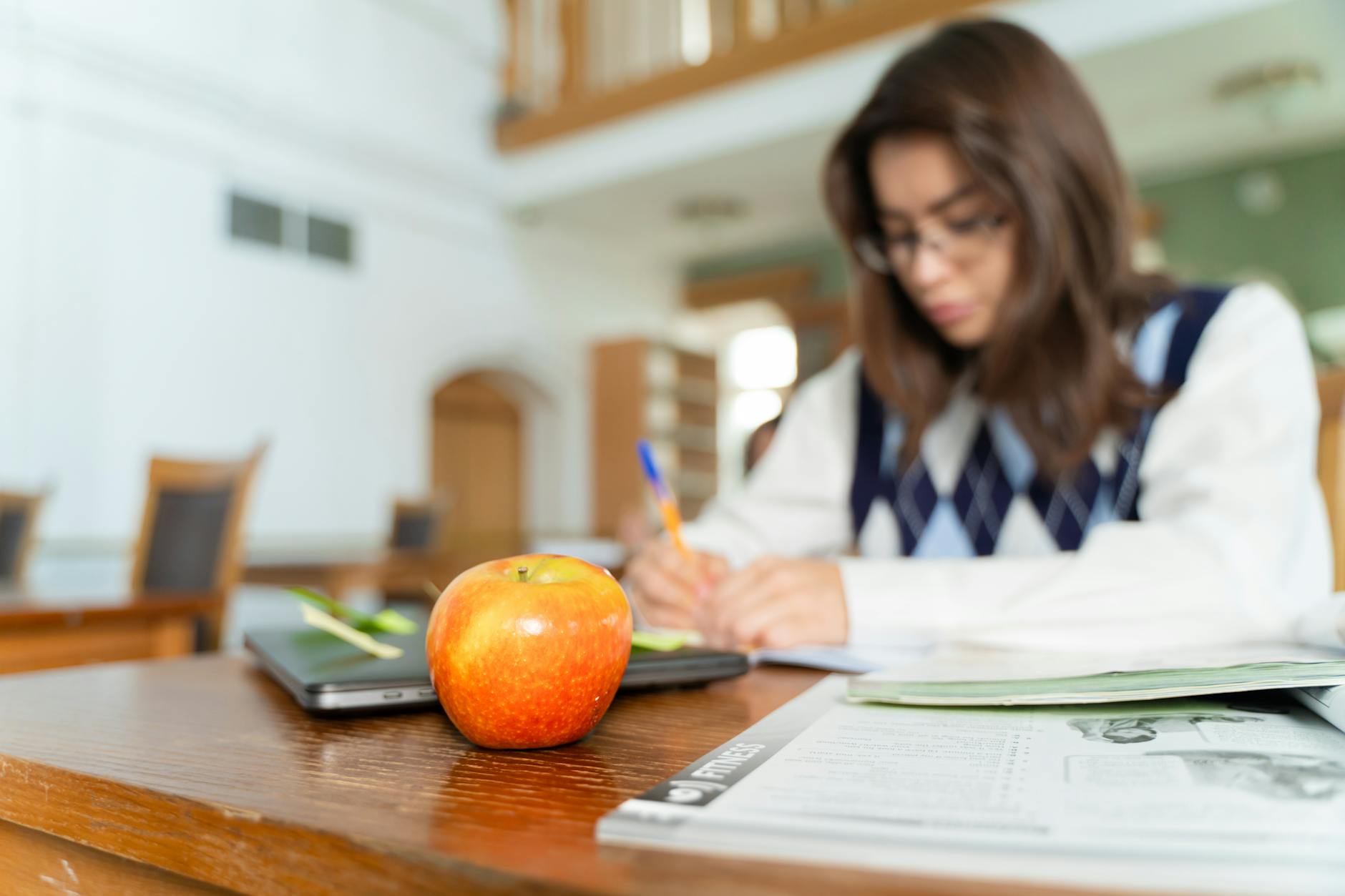 Young student wearing headphones while studying, illustrating voice-based learning and communication