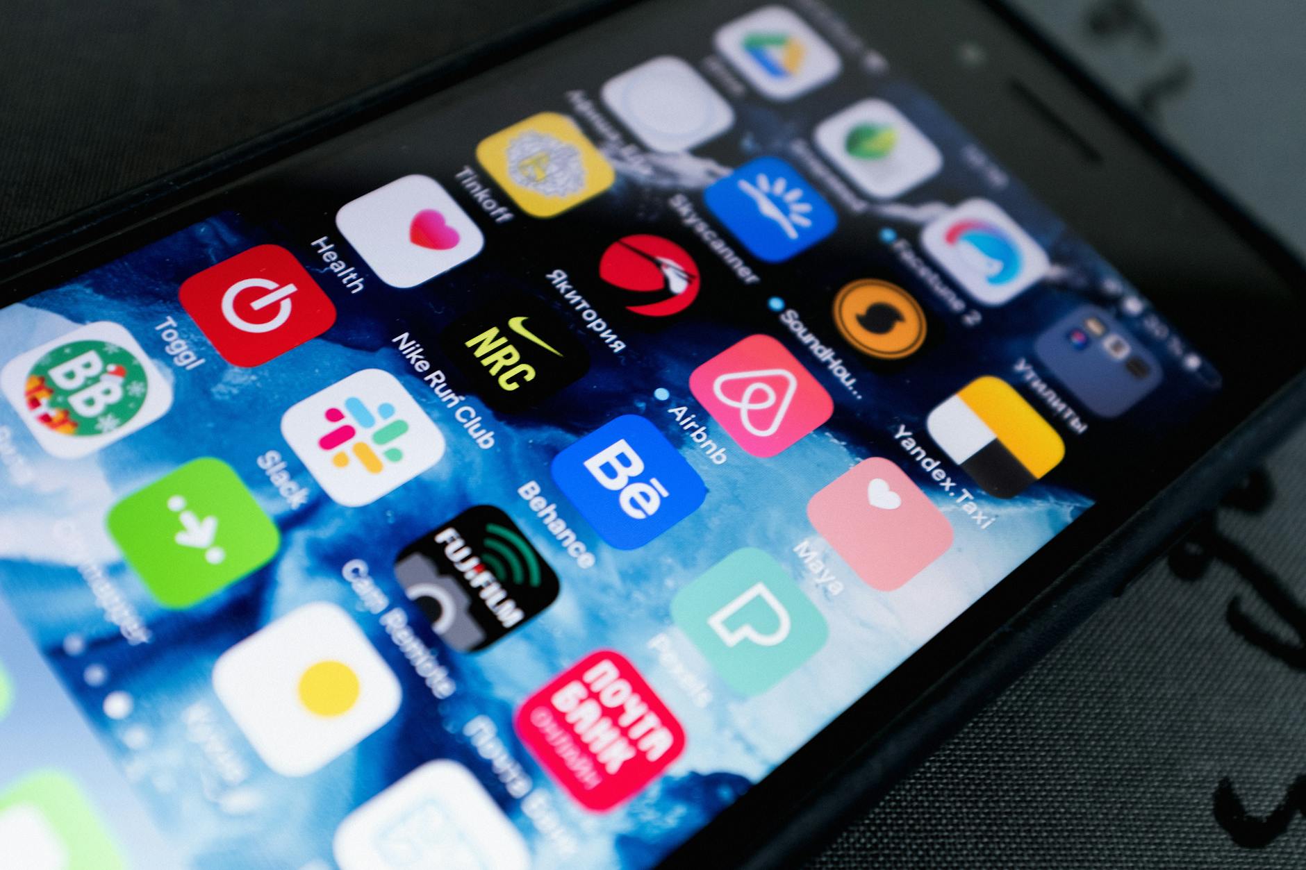 Mobile phone screen displaying various social media application icons and interfaces