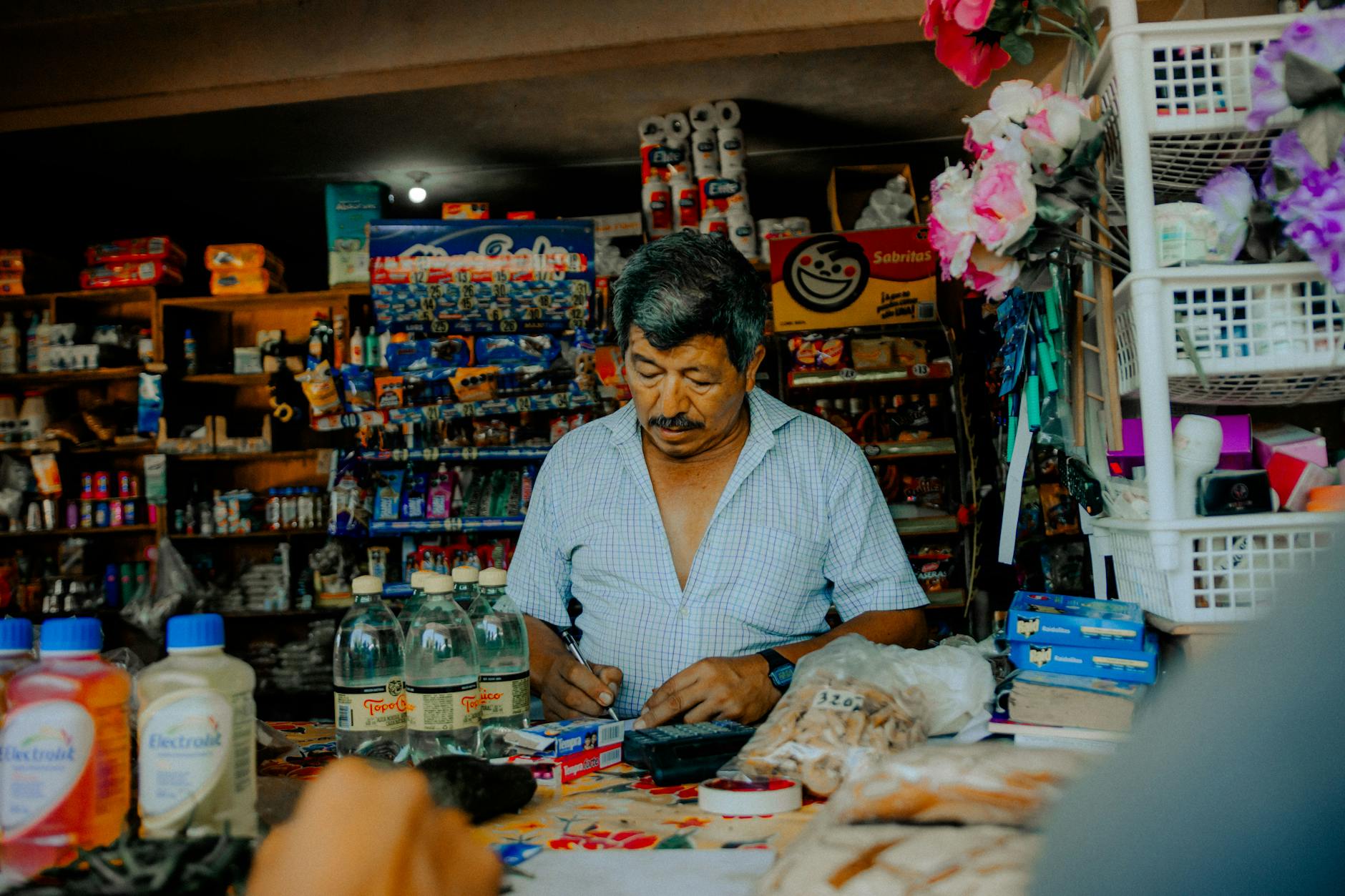 Interior view of small retail store with products on shelves