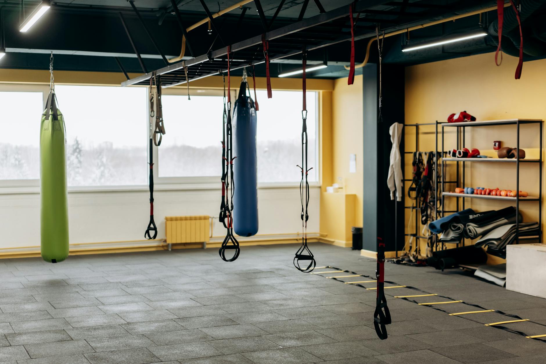 Modern gym interior with exercise equipment and open workout space