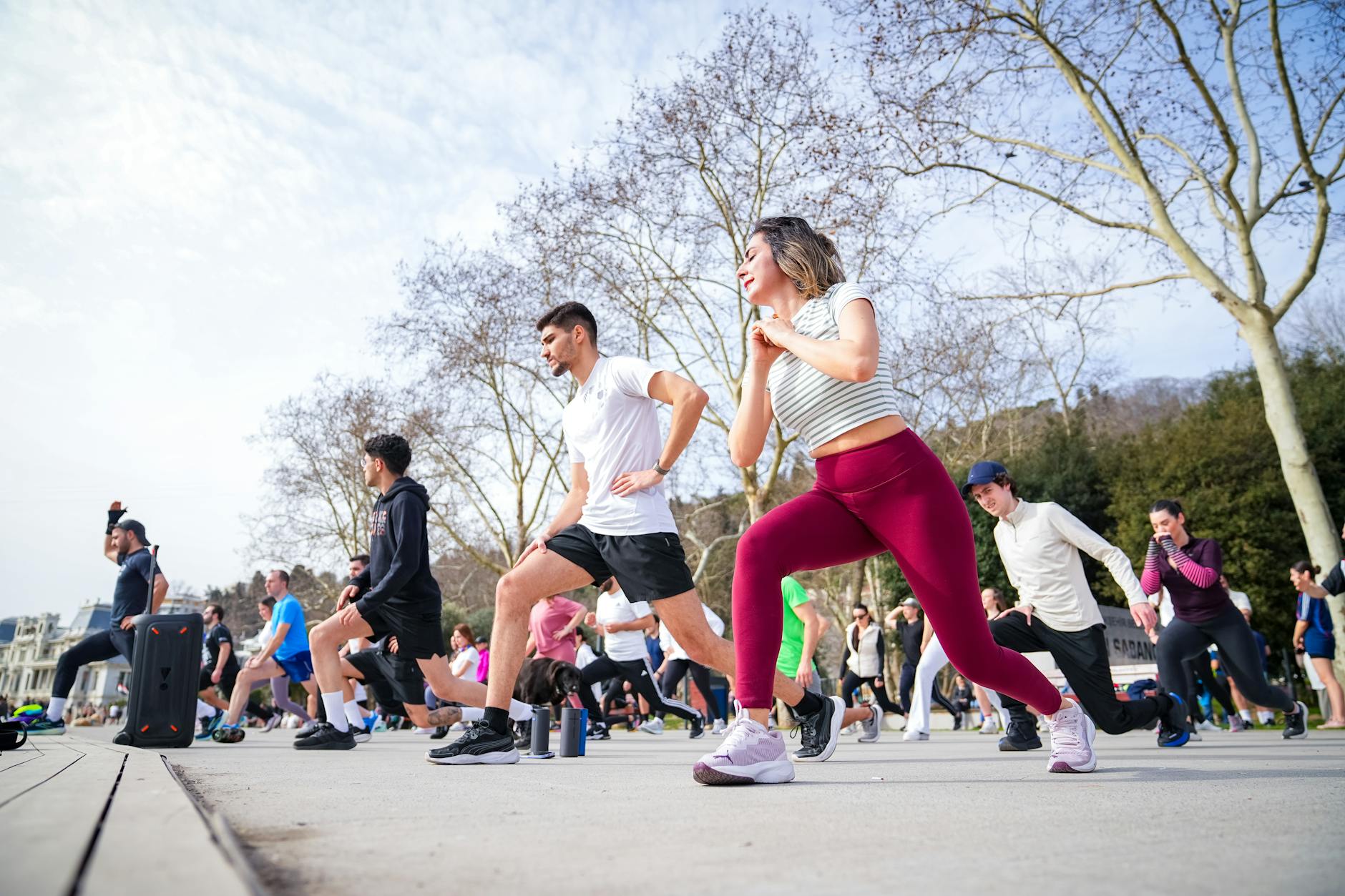 People exercising together in a bright modern fitness studio environment