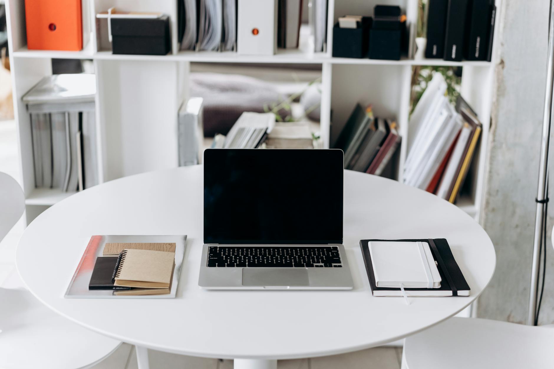 Modern office workspace with laptop and coffee cup, showing typical professional work environment