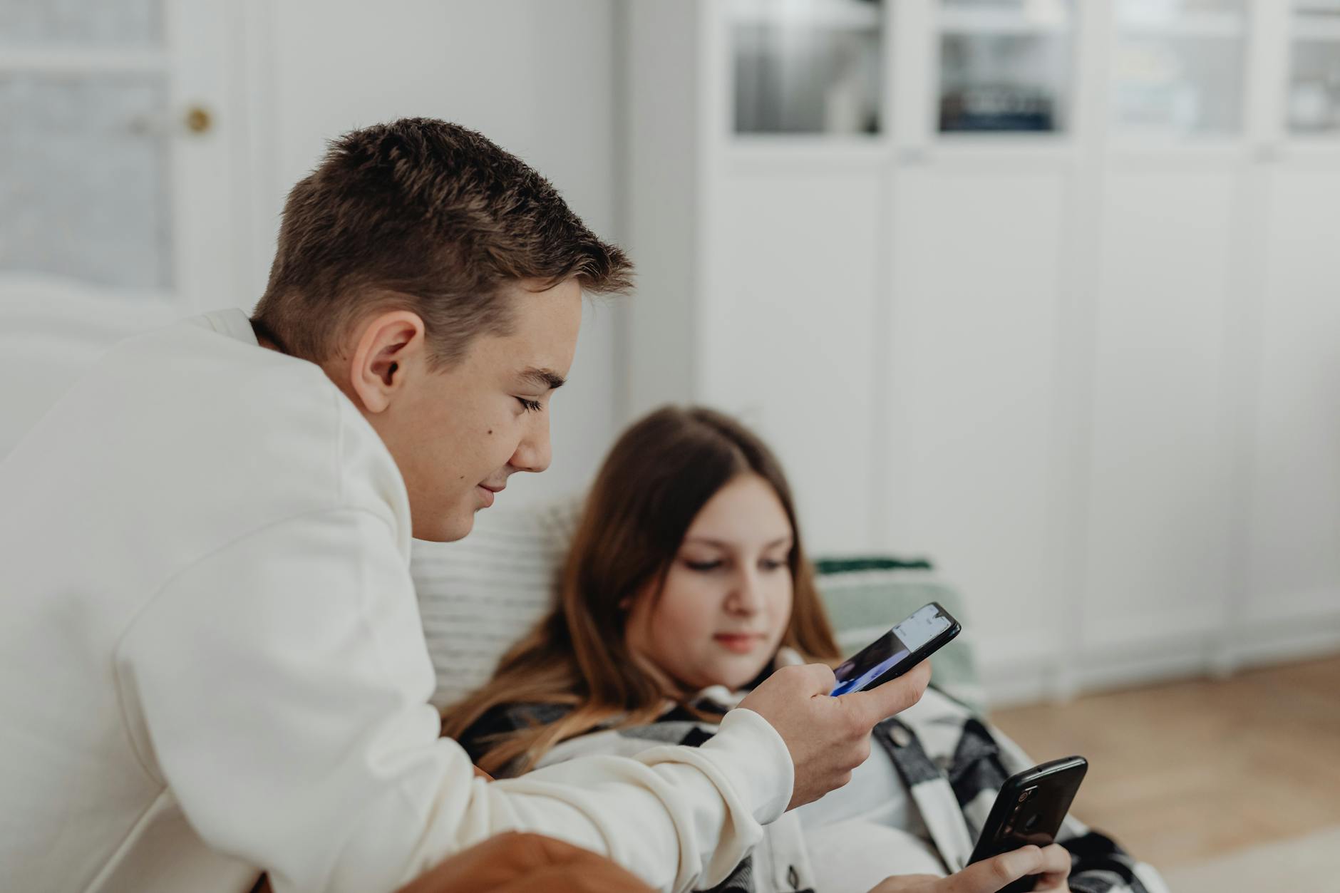 Group of young people using smartphones for social media sharing and communication