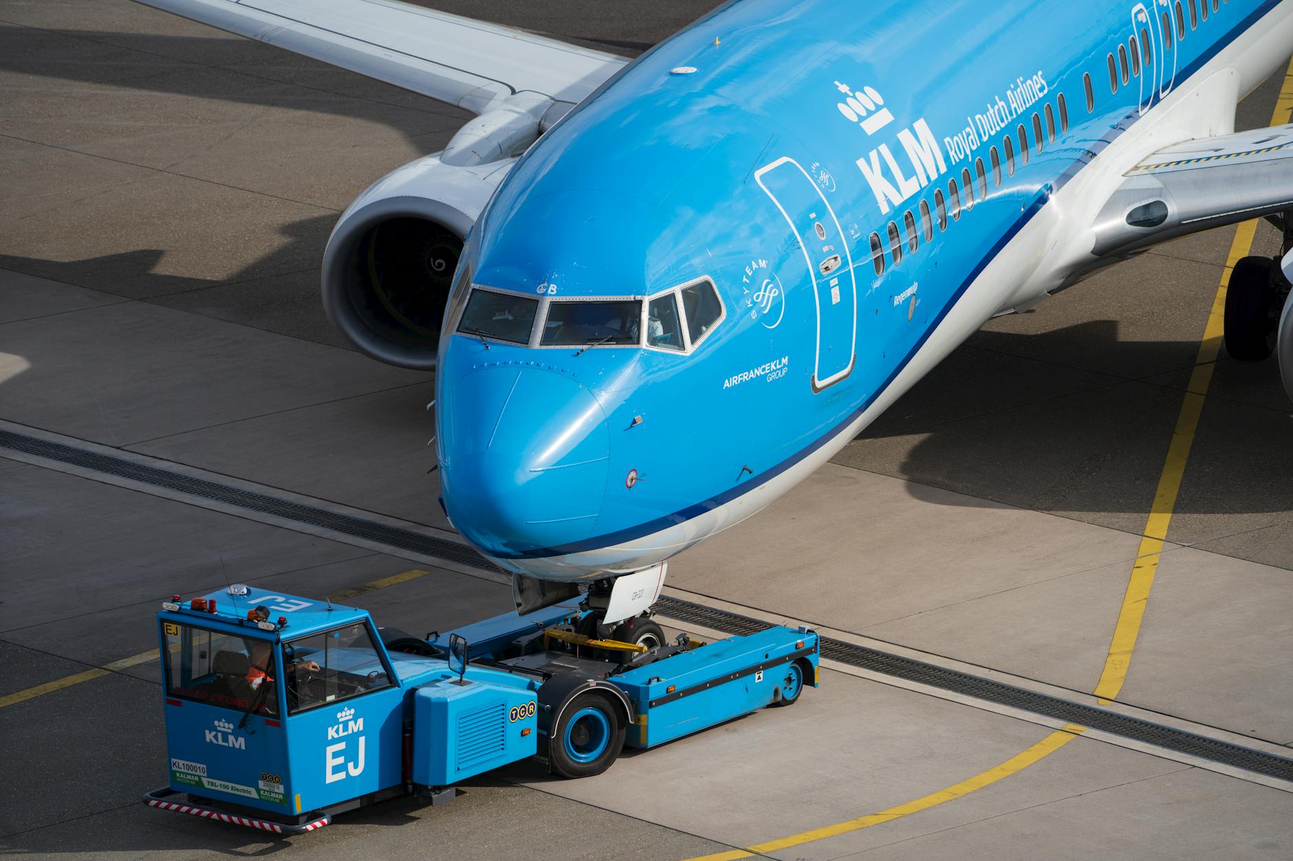 Commercial airplane on tarmac being prepared for flight