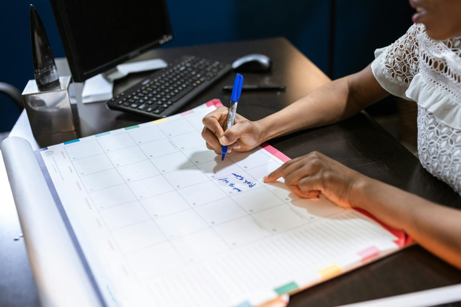 Open planner and calendar on a clean desk workspace
