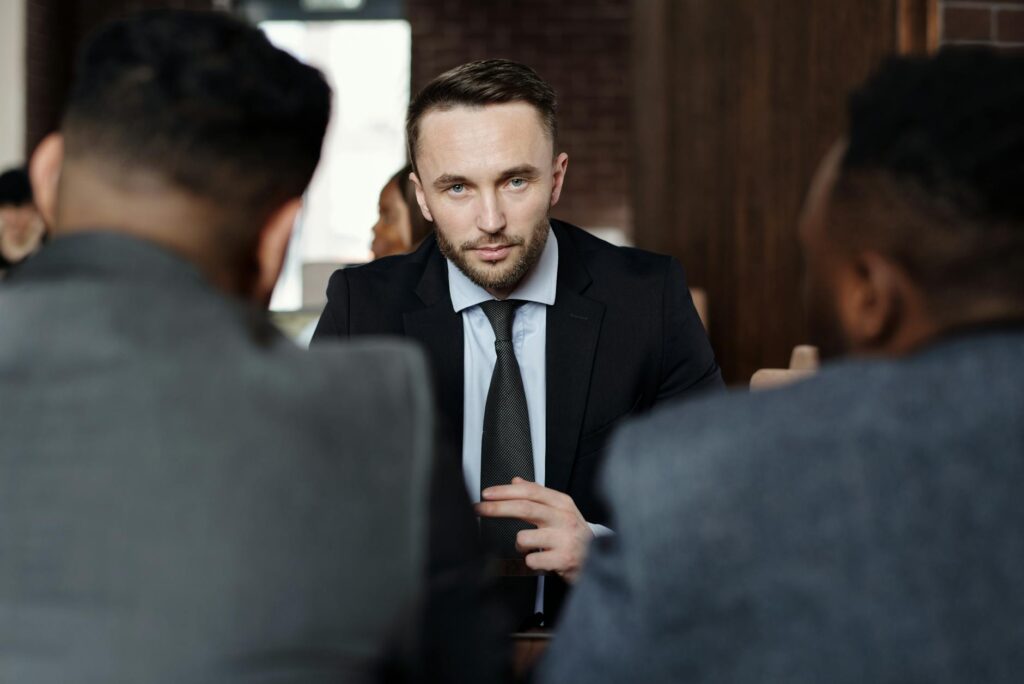 OpenAI’s ChatGPT Enterprise Rollout Faces Resistance from Legal Teams Corporate executives discussing technology implementation in conference room