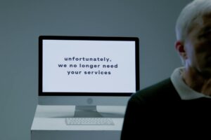 Empty office cubicles and desks representing workforce reduction