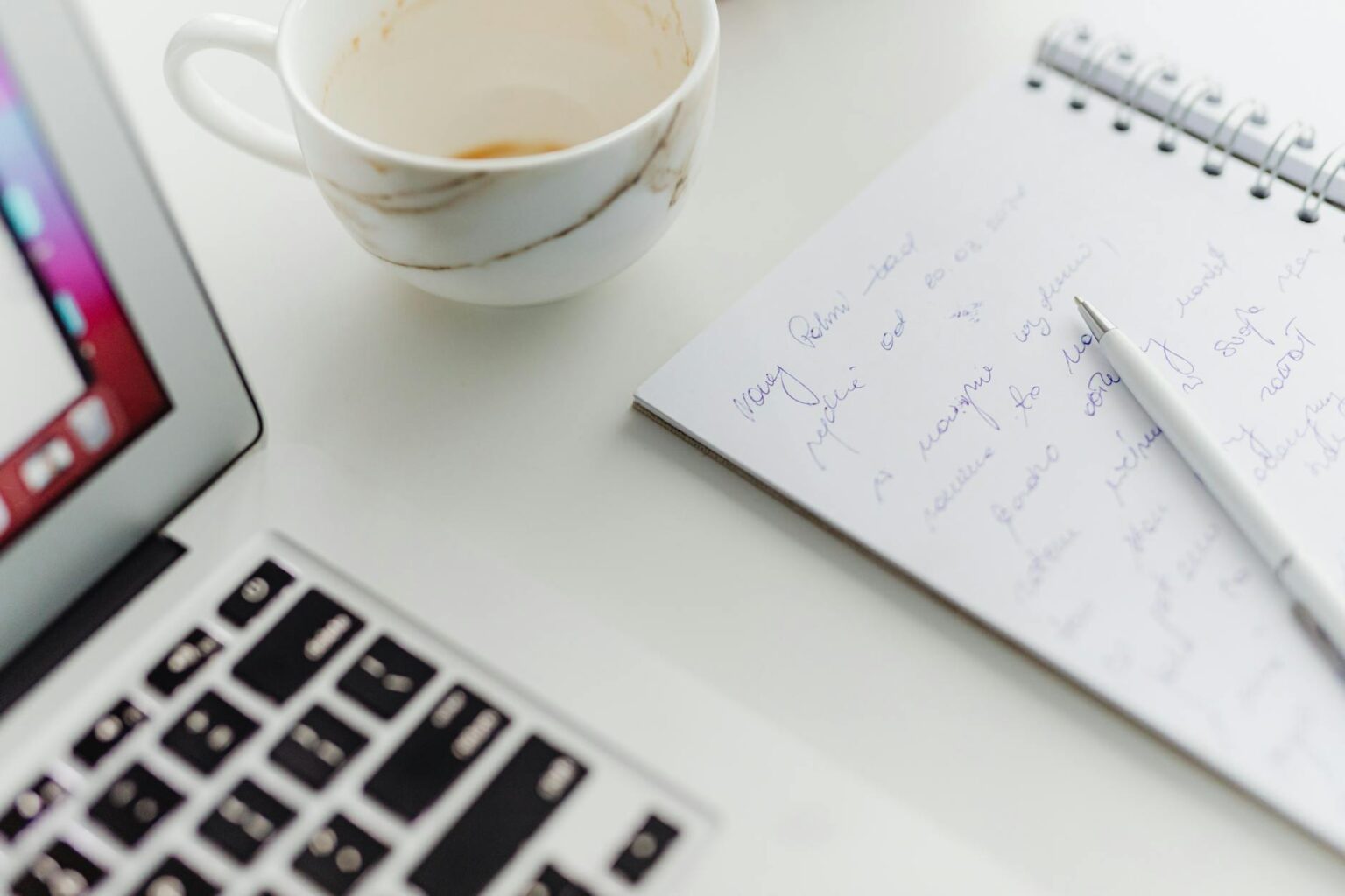 Person typing on laptop computer for newsletter writing and content creation