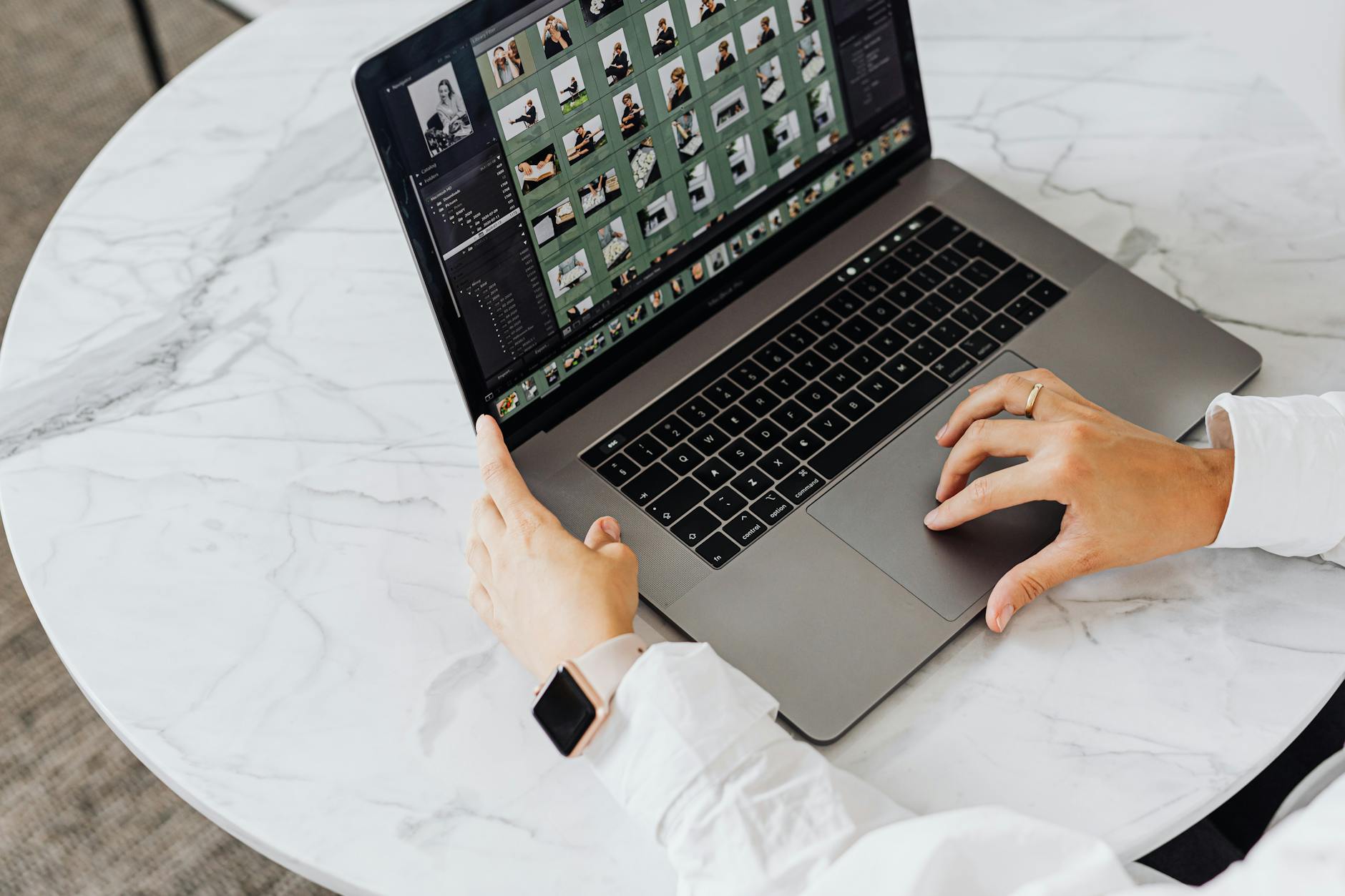 Person working on a laptop with a productivity application open on screen