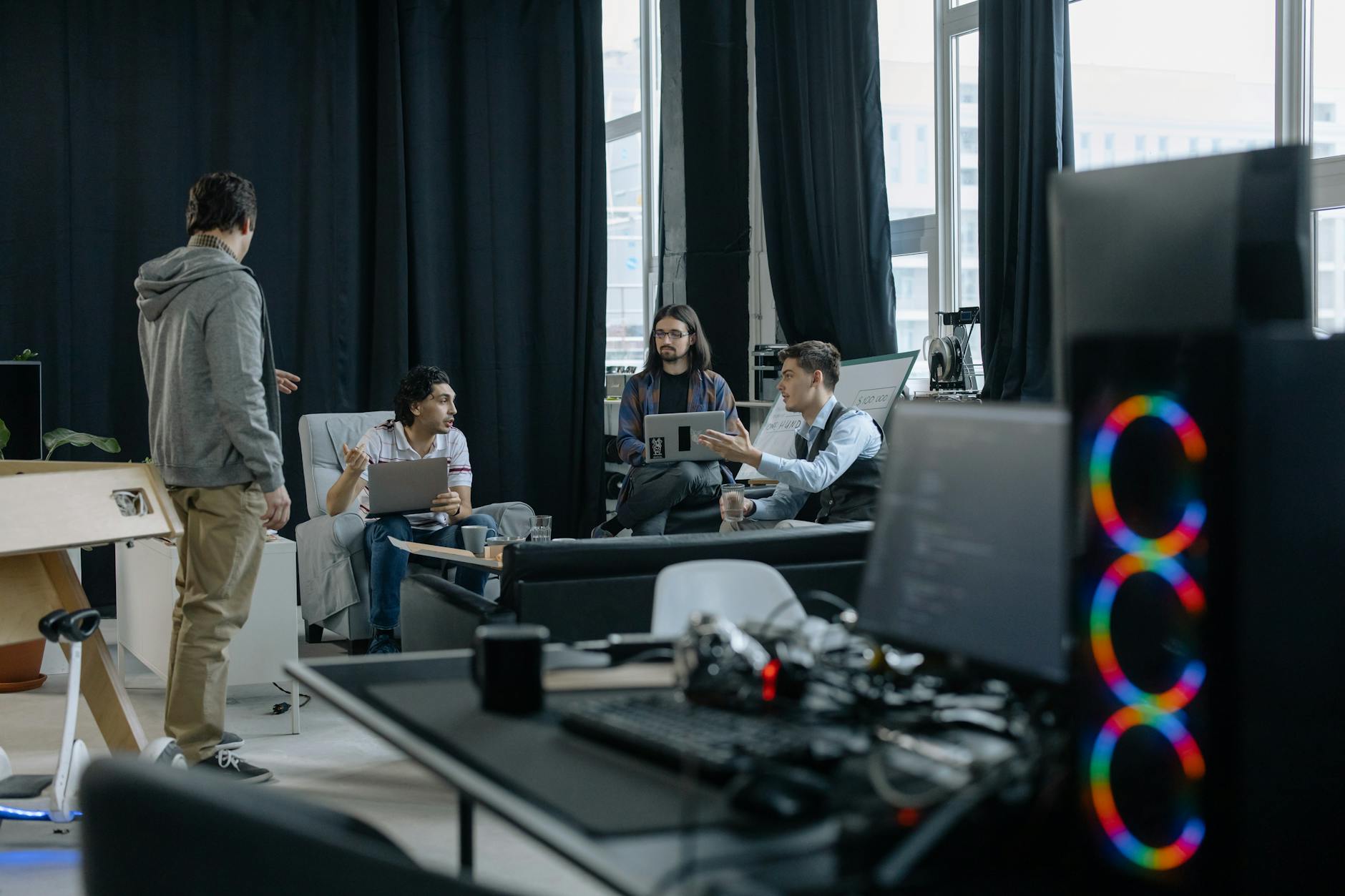 Engineers collaborating in a modern startup office environment