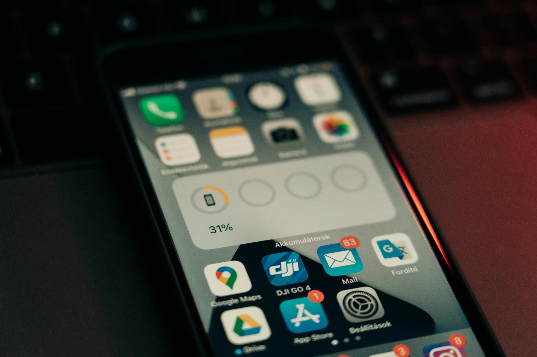 Smartphone screen showing multiple email notifications and app alerts
