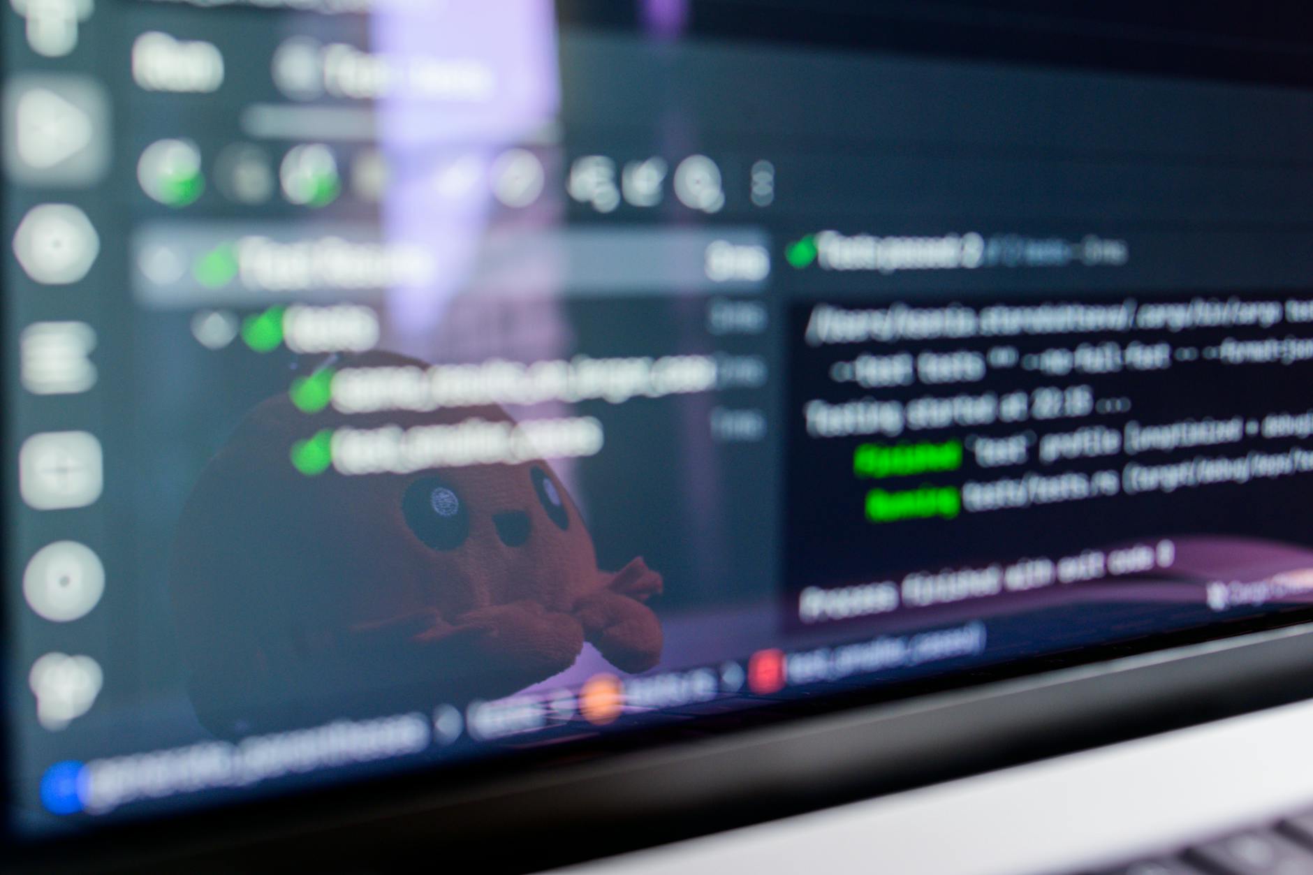 Close-up of a laptop screen showing lines of programming code