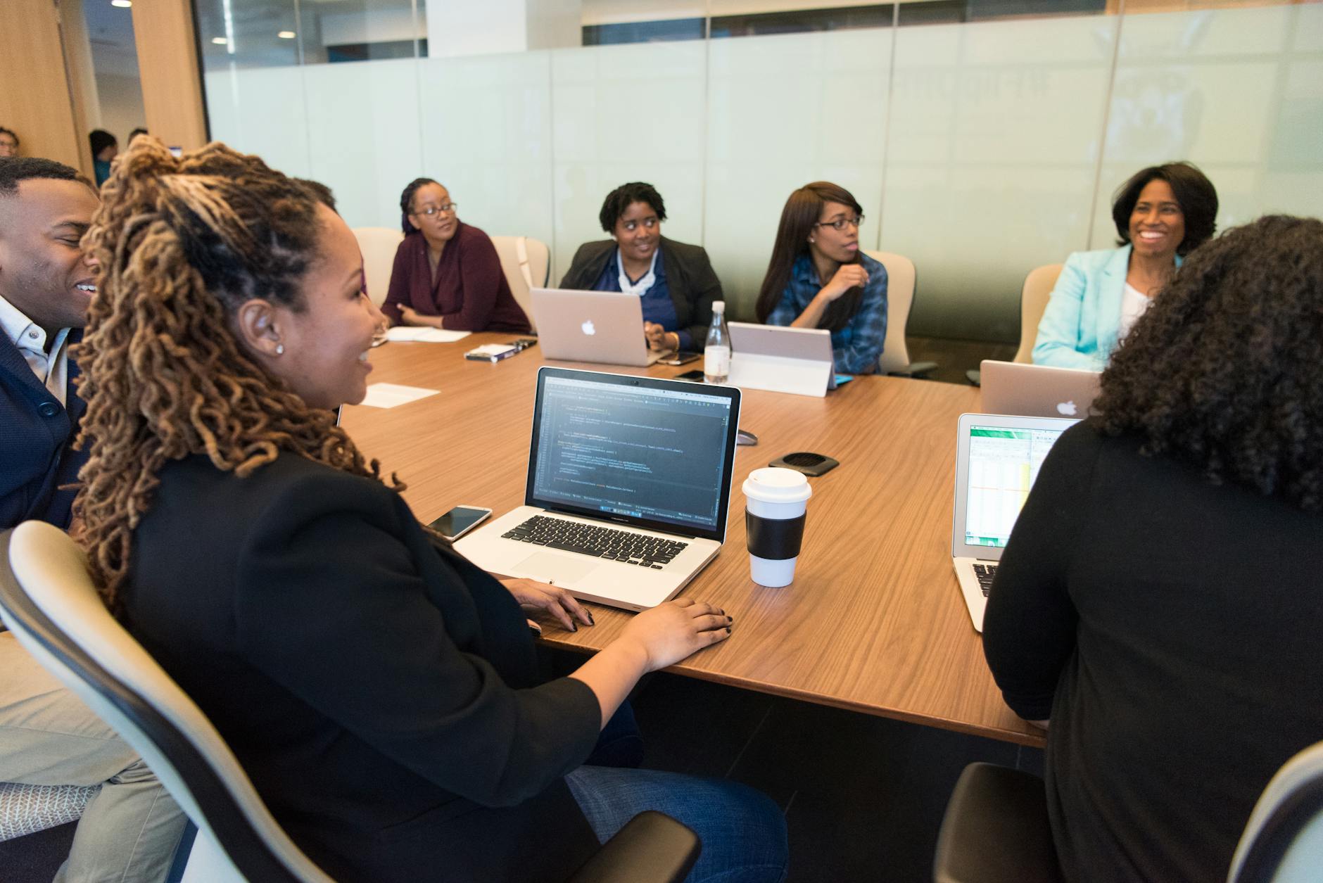 Enterprise technology professionals in a strategy meeting around a conference table