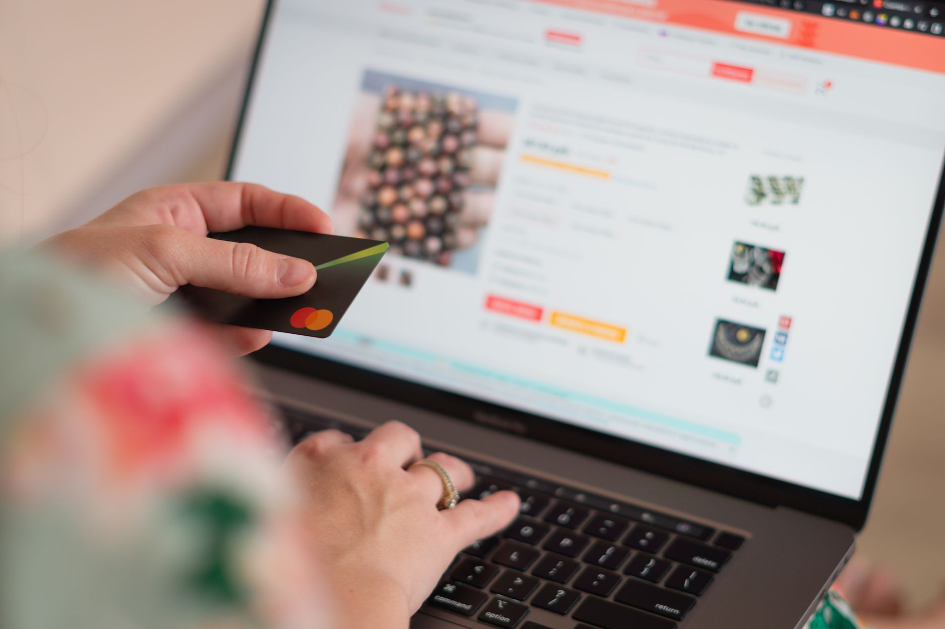Person browsing and shopping online using a laptop computer