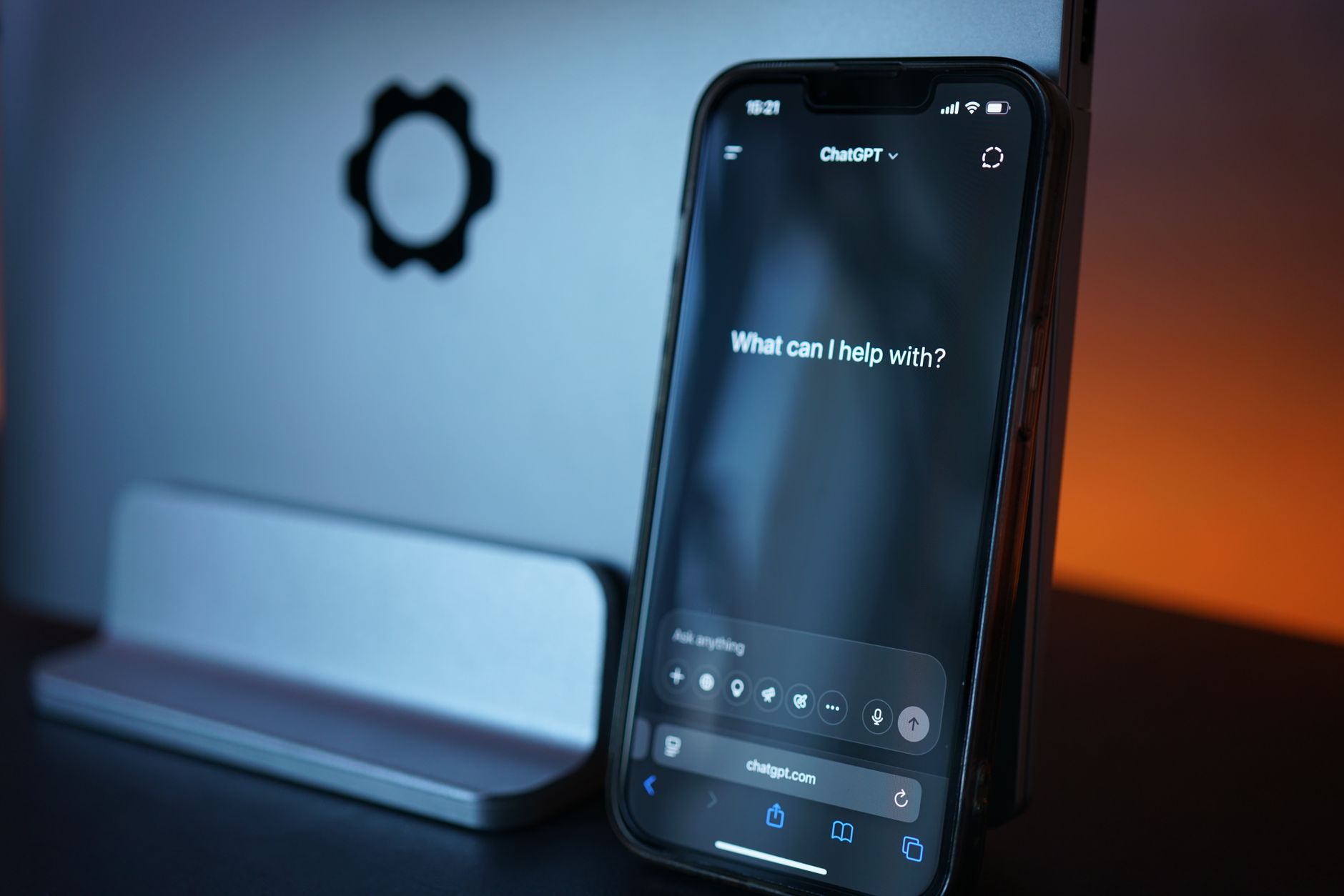 Person holding a smartphone using a voice assistant app