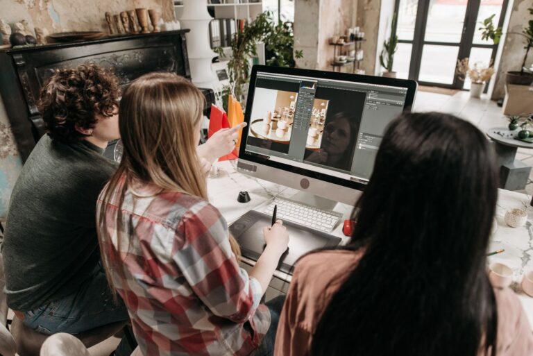 Creative team collaborating on digital content in a modern office environment