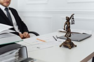 Attorney reviewing legal documents at a desk, representing small law firm research workflow
