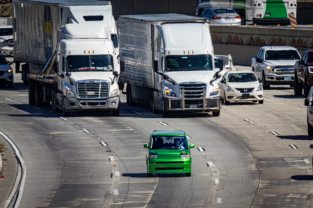 Self-driving vehicle navigating an urban road during a test deployment