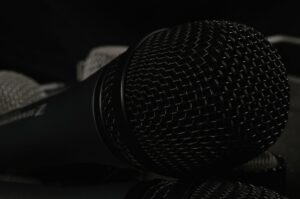 A close-up of a desktop microphone used for voice dictation and AI speech tools