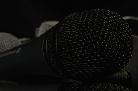A close-up of a desktop microphone used for voice dictation and AI speech tools