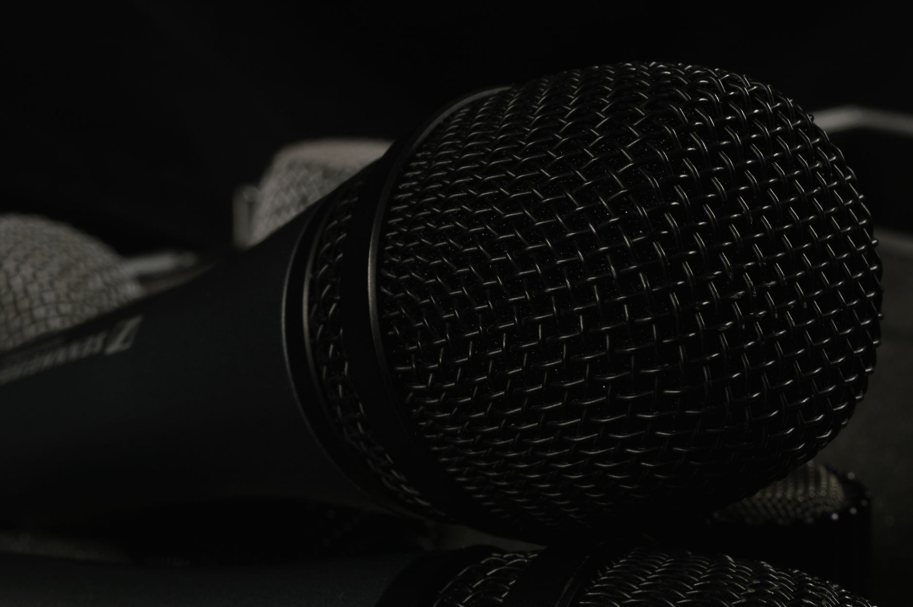 A close-up of a desktop microphone used for voice dictation and AI speech tools