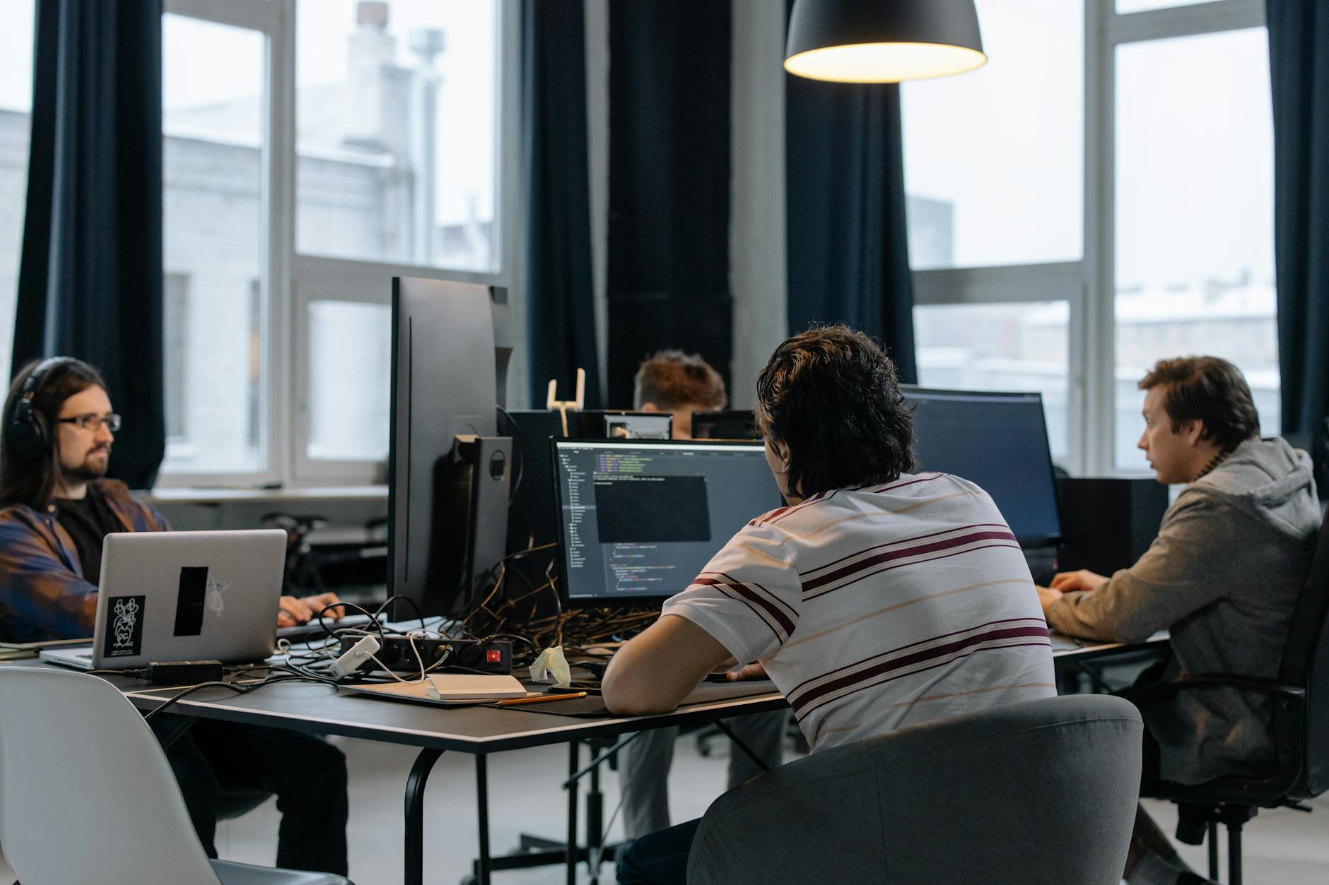 A software engineer working at a desk, representing the type of technical roles AI hiring platforms screen for