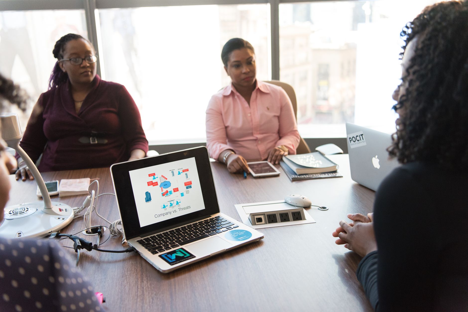Business professionals reviewing technology strategy in a corporate meeting setting