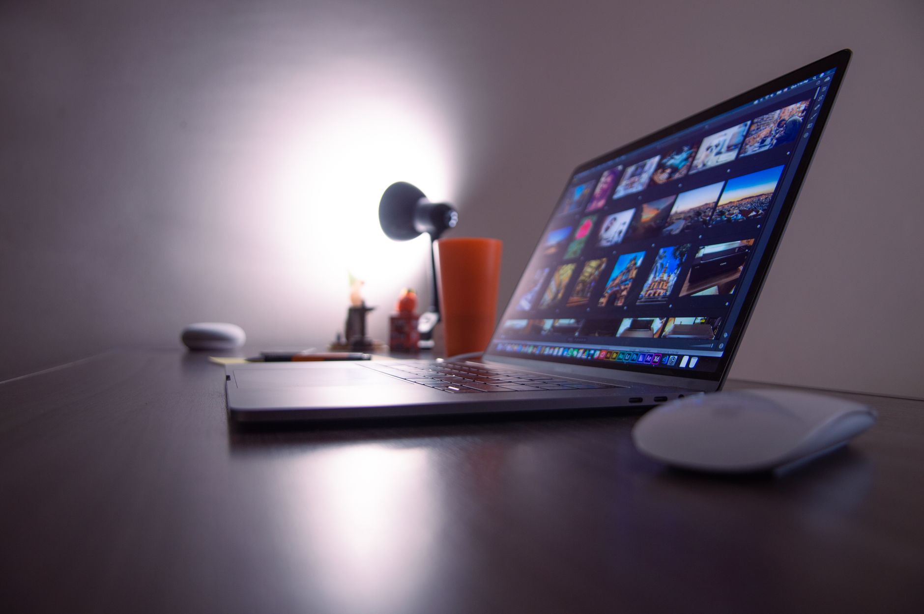 A person working at a dual-monitor setup with scheduling and task management tools visible