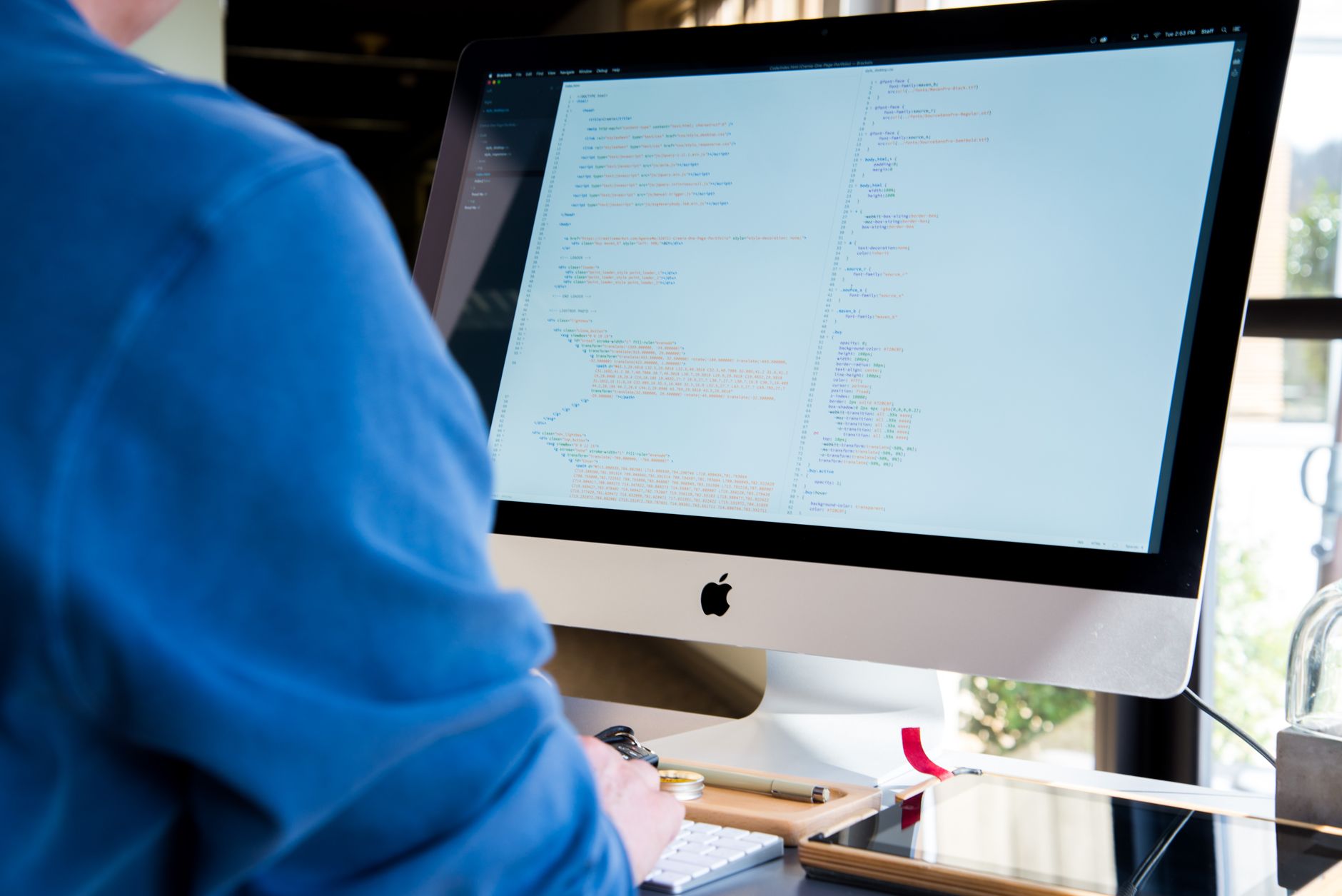 Software developer working on enterprise AI integration at a computer workstation