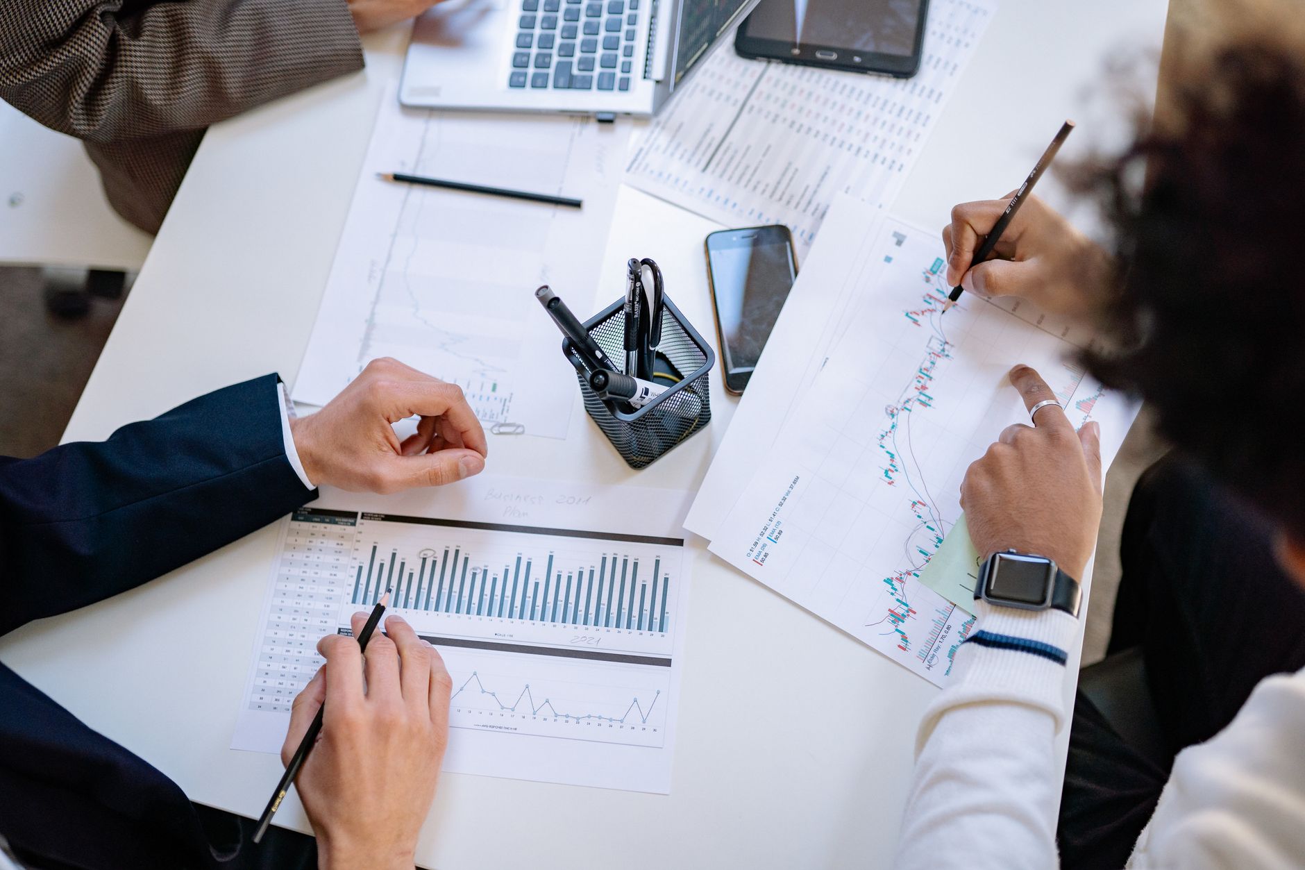 Business professionals discussing investment strategy in a conference room