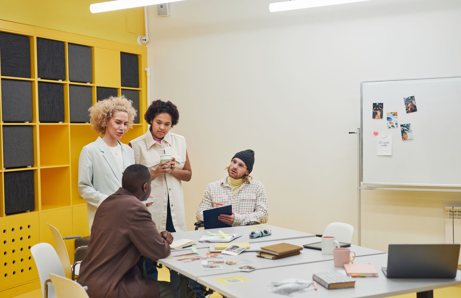 Small team working in an open-plan startup office environment