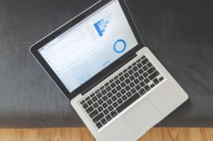Glide’s No-Code Push Is Squeezing Retool’s Internal Tools Base A person working on a data dashboard on a desktop computer in a modern office