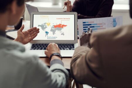 Deel’s Global Payroll Push Is Cornering Rippling’s International Base Business professionals in a meeting discussing global payroll and international HR strategy