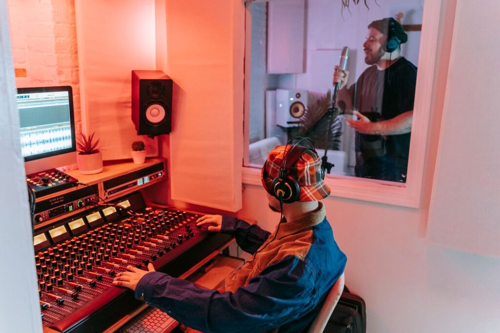 Suno’s AI Music Tools Are Squeezing Splice’s Creator Subscriptions A music producer working at a studio workstation with headphones and software open on screen