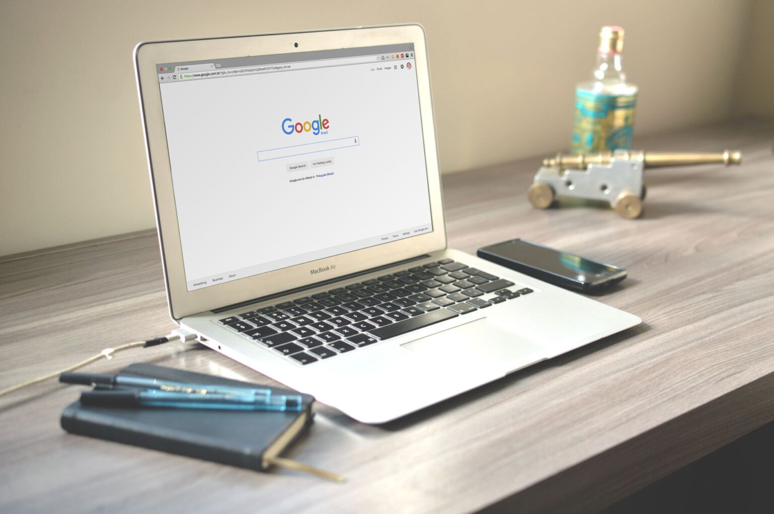 Employee using enterprise search software on a laptop in a modern office setting