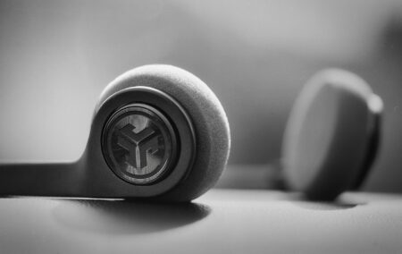 Speechify’s Audio AI Is Quietly Draining Audible’s Subscriber Base Person wearing headphones listening to audio content on a smartphone