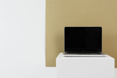 Person working on a presentation design on a laptop computer