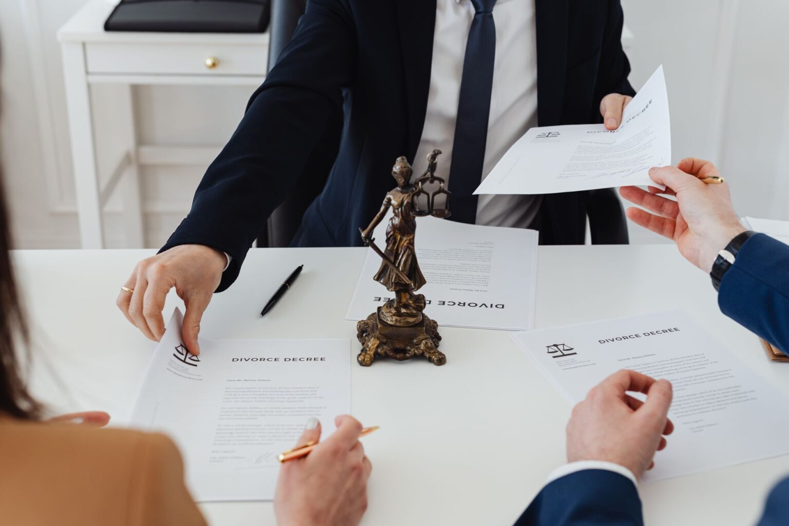 Business documents and contract papers spread across an office desk